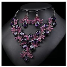 Thanks For Stopping By! While You’re Here Please Take A Look At The Other Listings In My Shop. Bundle To Save On Shipping! About This Item: This Elegant Jewelry Set Features A Statement Necklace And Matching Earrings. Crafted With Vibrant Purple And Pink Crystals, It Enhances Any Formal Attire. Necklace Length: 42 Cm/16.54 Inches Earring Length: 4.7 Cm/1.85 Inches Pendant: 8.3 Cm/3.27 Inches Material: Crystal Color: Purple, Pink Condition: New With Tags Elegant Purple Crystal Rhinestone Necklace, Unique Jewelry With Large Purple Pendant, Luxury Ornate Purple Necklace, Pink Crystal Necklace, Elegant Purple Multi-stone Necklaces, Elegant Pink Multi-stone Necklace, Vibrant Purple, Couture Jewelry, Formal Attire