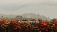 trees with red leaves in the foreground and mountains in the background