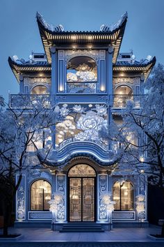 the building is lit up in blue and white