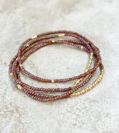 "Seed bead stretch bracelet set of 4 in Rainbow orange seed beads accented by gold toho seed beads. Elasticated on strong stretch cord. Great for stacking or mixing and matching.  - Toho seed beads - Seed bead sizes are 11/0 - Elasticated  - Gift bag  - All orders are hand crafted in a smoke free home. Ships within 24 hours SIZING** Bracelets are made to the standard sizing of 7.0\". One fits most.  If you need specific size (larger or smaller than 7.0\") please send me a message prior to buying Beaded Bracelet Sets, Autumn Bracelet, Star Bracelet, Homemade Jewelry, Beaded Jewelry Patterns, Seed Bead Bracelets, Beaded Stretch Bracelet, Seed Bead Jewelry, Hand Made Jewelry