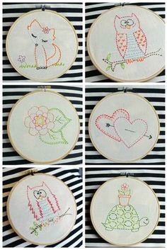 four different pictures of embroidery designs on wooden hoops with black and white striped background