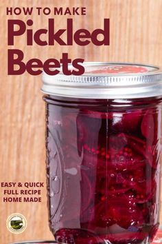 a jar filled with pickled beets sitting on top of a table