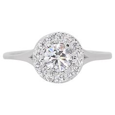 a white gold engagement ring with round diamonds