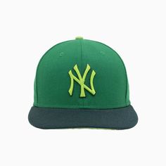 the new york yankees'green and navy fitted - back hat is shown in front of a white background