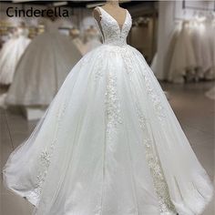 a white wedding dress on display in a store