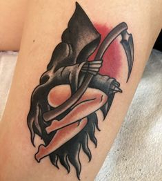 a woman's leg with a tattoo on it and an arrow in the middle