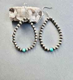 Native American Indian Jewelry.  Gorgeous handcrafted Navajo Pearl Hoops with Turquoise.  A style of earrings the Navajo Artist's are well known for these are made by the talented Navajo artisan Mason Lee.  Made from Turquoise & 5mm Sterling Silver Navajo Pearls.  These measure  3"L x 1 1/2"W.  Beautiful craftsmanship in a in a traditional design will certainly be a great gift yourself or for a special person under the tree!    Please look at all photos closely. Welcome to NorthWestTradingCo Southwestern Teardrop Jewelry For Festivals, Rustic Nickel-free Round Bead Jewelry, Adjustable Southwestern Teardrop Jewelry, Southwestern Adjustable Teardrop Jewelry, Rustic Beaded Dangle Jewelry, Southwestern Teardrop Jewelry For Jewelry Making, Artisan Hand-strung Teardrop Jewelry, Southwestern Jewelry With Round Beads For Pierced Ears, Southwestern Style Silver Beaded Dangle Jewelry