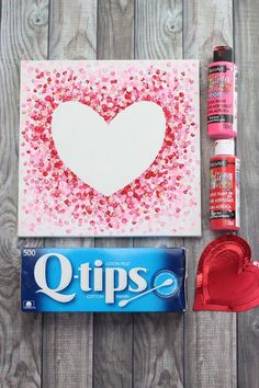 valentine's day crafting supplies including glue, paper heart and candy bar wrappers