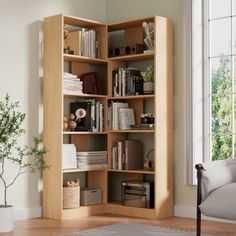 a living room filled with furniture and a book shelf next to a large white window