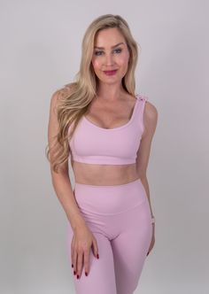 The Clara Bra is for those wanting an extra touch of femininity to their basic sports bra. Designed for comfort and cuteness whether you are running errands or enjoying your workout. This bra offers medium support, with a scoop neckline to flatter your figure. The best part is the dainty bows that adorn your shoulders for that little bit of extra. Details Removable Cup Inserts Adorable Shoulder Bows Scoop Cut Front & Back Elastic Ruffle Under Bust Band Non Adjustable Straps 4-Way Stretch Antimic Workout Activewear With Seamless Construction And Wide Straps, Athleisure Activewear With Built-in Bra And Scoop Neck, Scoop Neck Sports Bra With Built-in Bra For Training, Sporty Sports Bra With Wide Straps For Light Exercise, Sporty Sports Bra For Light Exercise With Wide Straps, Sporty Sports Bra For Pilates With Wide Straps, Athleisure Scoop Neck Sports Bra For Yoga, Functional Scoop Neck Sports Bra For Yoga, Functional Scoop Neck Sports Bra For Workout