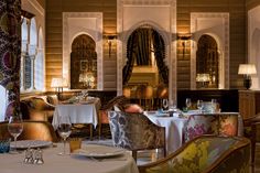 a dining room with fancy chairs and tables