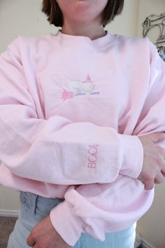 This sweatshirt is made with a blend of 60% cotton and 40% polyester fabric. Wash in warm or cold water and tumble dry low. This cozy sweater is perfect for your pink halloween. The ghost and writing on the sleeve are embroidered!  *this dress is made in an animal and smoke free home. Pink Sweatshirt For Fall Loungewear, Pink Long Sleeve Cotton Sweater, Cute Pink Fall Sweatshirt, Spooky Long Sleeve Sweatshirt For Winter, Spooky Cotton Sweatshirt For Winter, Cute Cotton Halloween Sweatshirt, Halloween Cotton Sweatshirt For Loungewear, Cotton Long Sleeve Halloween Sweater, Long Sleeve Cotton Halloween Sweater