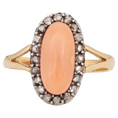 Stylish antique Victorian angel skin coral & diamond ring (circa 1880s to 1900s) crafted in 18 karat yellow gold. Cabochon cut angel skin coral measures 12mm x 5.5mm. The coral is in good condition and free of cracks or chips. 20 old rose cut diamonds total an estimated 0.20 carats (estimated at L-M color and I2-3 clarity). The light peach coral is set in a small oval shaped mount, accented with old rose cut diamonds. The cocktail ring makes a nice statement on the hand and is great for day to d Victorian Angels, Angel Skin, Light Peach, Rose Cut Diamond, Antique Rings, Antique Victorian, Cocktail Ring, Cocktail Rings, Rose Cut