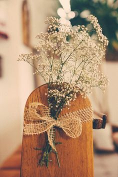 a wooden vase with white flowers tied to it's sides and the caption reads, don't let