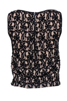 You are the life of the party when you walk into the room in this embellished top from Alice & Olivia! Complete with sequins, beads, and lace contrasting a nude sheer overlay with sharp black trim and a bold back exposed zipper. Style with a leather miniskirt, tall boots and a bright red lip for a Saturday night to remember. Pair with patent pumps, sleek black denim, and a leather jacket for a bit of edge! Size S Shell: 85% Cotton, 15% Nylon Combo: 100% Viscose Lining: 97% Polyester, 3% Elastane Glamorous Embellished Evening Tank Top, Sequined Sleeveless Tank Top For Party, Glamorous Embellished Tank Top For Evening, Glamorous Embellished Sleeveless Top, Glamorous Embellished Sleeveless Blouse, Evening Sleeveless Top With Contrast Sequin, Sleeveless Evening Top With Contrast Sequin, Black Contrast Sequin Fabric, Glamorous Sequined Tank Top For Parties