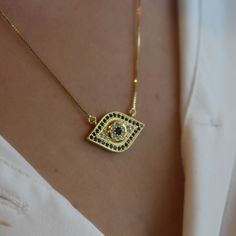 This evil eye necklace is perfect to bring meaning to your outfit. It's a protection against bad energies and it will bring Joy to your life. This design will be a favorite one to all who like to wear a beautiful and meaningful jewelry and minimalist jewelry. Product details: • 18k Gold plated evil eye necklace. • Chain size: 18" Adjustable: 2". • Pendant studded with blue and crystal zirconia stones. • Clamp closure. • All necklaces go inside the box. The gift bag will only be available if you Everyday Evil Eye Pendant Necklace, Spiritual Evil Eye Necklace For Everyday, Everyday Spiritual Evil Eye Necklaces, Everyday Spiritual Evil Eye Necklace, Blue Evil Eye Necklace, Brazilian Jewelry, See You Around, Meaningful Jewelry, Blue Evil Eye