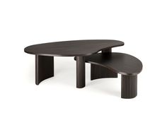 an oval table with two smaller tables on each side, one in black and the other in brown