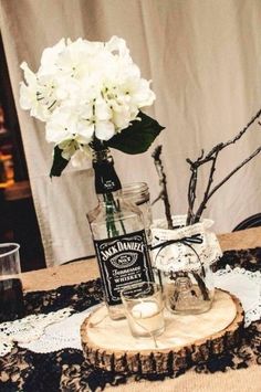 Using whiskey bottles rather than wine bottles. Jack Daniels Table Centerpieces, Aged To Perfection Centerpieces, Jack Daniels Wedding, Festa Jack Daniels, Jack Daniels Party, Biker Wedding, Jack Daniels Bottle, Rock Wedding, Rustic Wedding Centerpieces