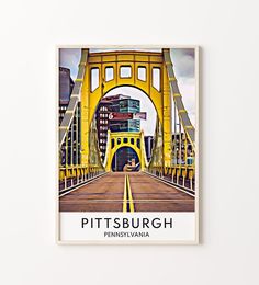 a yellow bridge with the words pittsburgh on it