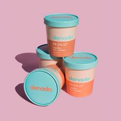 three ice creams are shown on a pink background with the word denod written below them