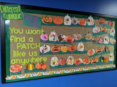 a bulletin board with pumpkins and words on it