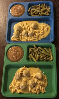 three trays filled with different types of food