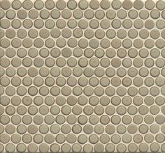 a tile with circles on it in beige and white colors, as well as an image of