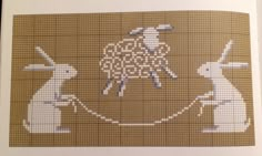 a cross stitch pattern with some animals on it