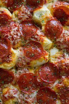 pepperoni pizza with cheese and herbs on it