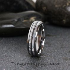 a wedding band that has been set in white gold and silver