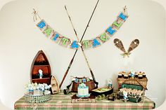 there is a birthday banner on the table with other items in front of it,