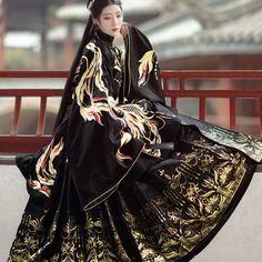 The Vividly Embroidered Phoenix Weaving Along The Sleeve Of Coat Grants Its Wearer Everlasting Peace And Blessings. Also, The Side Slits Bring Slimming Effect And Enhance The Sense Of Hierarchy. This Elegant Mingfu Coat Is Perfect To Pair With Hanfu Pleated Skirt Or Any Modern Bottoms. Stand-Up Collar Side Slit Fitted Waist Band Exquisite Phoenix Embroidery 6-Meter (19.7") Woven Gold Pleated Skirt Full Set Includes 1 Top And 1 Maxi Skirt Gold Pleated Skirt, Peace And Blessings, Traditional Asian Dress, Ancient Dress, Ancient Chinese Dress, Ancient Chinese Clothing, Fantasy Dresses, Elegante Casual, Fantasy Dress