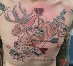 a man with tattoos on his chest has an image of a rabbit holding a bow