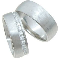 two white gold wedding rings with channeled diamonds on each side, set in 18k white gold