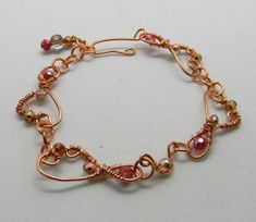 Hey, I found this really awesome Etsy listing at https://www.etsy.com/listing/692990258/delicate-copper-swirl-bracelet-with-pink Rose Gold Wire-wrapped Copper Bracelets, Pink Wire Wrapped Copper Jewelry, Bohemian Rose Gold Wire Wrapped Bracelets, Gold Wire Wrapped Copper Bracelets, Adjustable Pink Copper Jewelry, Swirl Bracelet, Bead Shapes, Copper Crystal, Pink Copper