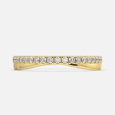 a yellow gold wedding band with diamonds