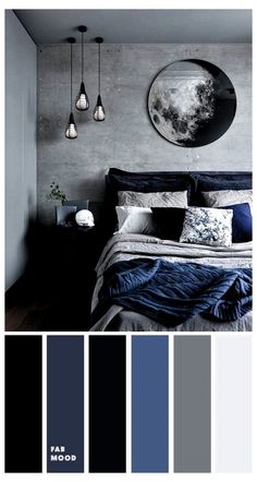 a bedroom with grey walls and blue bedding