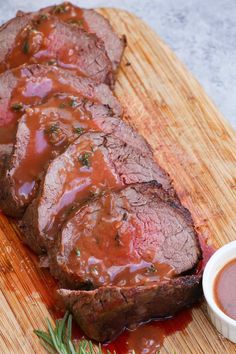 meatloaf with sauce and garnish on a cutting board