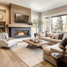 a living room filled with furniture and a fire place in the middle of it's wall