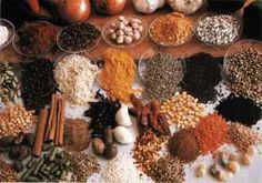 an assortment of spices and nuts on a table