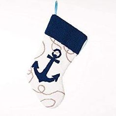 a stocking with an anchor on it hanging from a blue ribbon and white background