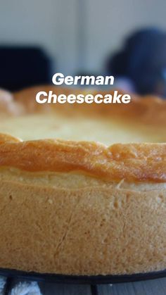 a close up of a cheesecake on a pan with the words german cheesecake above it