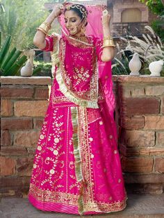 Gotta Patti Humarai Pure Rajputi Poshak In Pink Color-81891 Product Details: Fabric: Humarai Fabric with Humarai Pure Odhni Work: Heavy Barik Gotta Patti work with Foiling zari and stone work Heavy Odhni fore side work with pallu work and gotta turri Heavy Kurti work with Galla work and Astin work Color Family: Pink Style:Rajasthani, Rajputana Occasion:Festive, Traditional,Wedding Washing Instruction:Dry Wash The Semi-stitched Lehenga Waist and Hips are Customizable from 28 to 40 inches and from Traditional Lehenga With Sheer Dupatta For Ceremony, Traditional Drape Lehenga With Cutdana For Ceremony, Traditional Wear With Sheer Dupatta For Ceremony, Pink Sharara With Zari Work For Ceremonies, Festive Ceremony Choli With Sheer Dupatta, Pink Semi-stitched Traditional Wear For Ceremony, Traditional Cutdana Lehenga For Ceremony, Ceremony Anarkali Set With Zari Work In Traditional Drape, Ceremonial Sharara With Cutdana And Traditional Drape