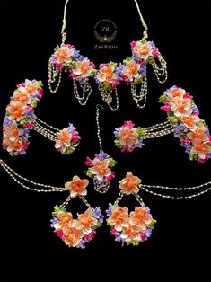 a necklace and bracelet with flowers on it