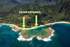 an aerial view of the water and land in front of some mountains with green arrows pointing to it