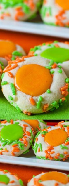 some cookies with green and orange icing on them