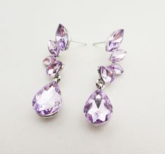 Pretty lilac faceted crystal, floral design teardrop earrings. Light and comfortable to wear. The earrings have a stud post, for pierced ears. All items are carefully packaged and presented in a free gift box. Thank you for looking. Elisabeth Rose Light Purple Earrings, Earrings For Wedding, Bridesmaids Earrings, Wedding Purple, Purple Bridesmaids, Purple Earrings, Wedding Jewelry Earrings, Faceted Crystal, Metal Earrings