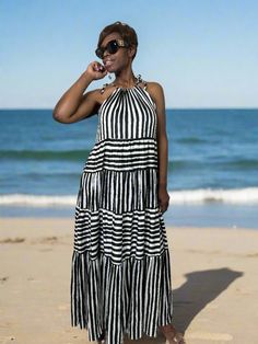 (Free shipping on all domestic orders over $100) Embrace effortless elegance in our Sleeveless Stripe Maxi Tiered Dress. Its flowing silhouette and tiered construction add a touch of whimsy to the classic stripe pattern. Perfect for any occasion, this dress will make you feel like a work of art Fabric: 1000% Polyester Size & Fit: Fits True to size POLICYS View Our Shipping Policy View Our Return/Refund Policy Terms & Conditions HAVE A QUESTION? Contact Us Here Striped Sleeveless Dress, Striped Maxi, Tiered Dress, Large Black, Stripes Pattern, Sleeveless Dress, Summer Dresses, Black And White, White