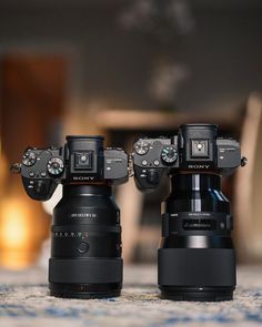 two cameras sitting on top of each other