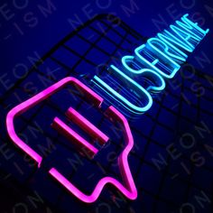 a neon sign with the word cosmic on it's side and an arrow in the middle